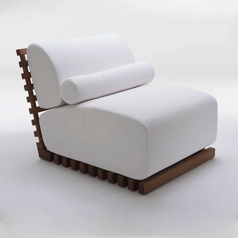 Sillón de teca con cojinería de exterior